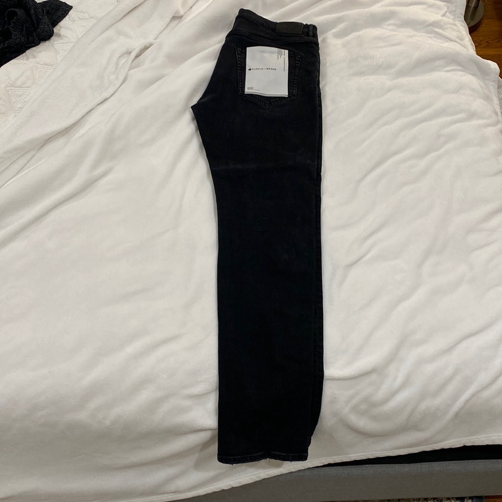 Black faded purple jeans